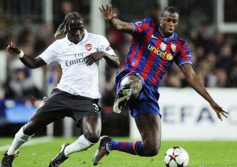 FC Barcelona's Yaya Toure from Cote d'Ivoire, right, duels for the ball with Arsenal's Bacary Sagna from France, left, during their Champions League quarterfinal second leg soccer match at the Camp Nou stadium in Barcelona, Spain, Tuesday, April 6, 2010. (AP Photo/David Ramos)