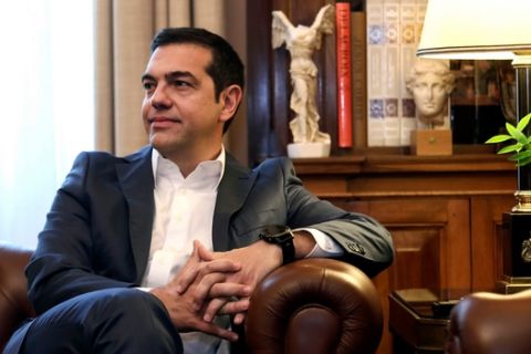 Greece's Prime Minister Alexis Tsipras looks on during a meeting with Greek President Prokopis Pavlopoulos at the presidential palace in Athens, Saturday, on May 19, 2018. Tsipras meets Greek president to brief him about developments in the ongoing efforts to resolve a dispute over neighboring Macedonia's name, which has frustrated the country's aspirations to join NATO and the European Union. (AP Photo/Yorgos Karahalis)