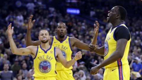 Golden State Warriors' Draymond Green, right, reacts as a foul is called against him next to teammates Stephen Curry, left, and Kevin Durant during the first half of an NBA basketball game against the Oklahoma City Thunder Saturday, Feb. 24, 2018, in Oakland, Calif. (AP Photo/Marcio Jose Sanchez)