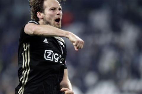 Ajax's Daley Blind celebrates at the end of the Champions League, quarterfinal, second leg soccer match between Juventus and Ajax, at the Allianz stadium in Turin, Italy, Tuesday, April 16, 2019. Ajax won 2-1 and advances to the semifinal on a 3-2 aggregate. (AP Photo/Luca Bruno)