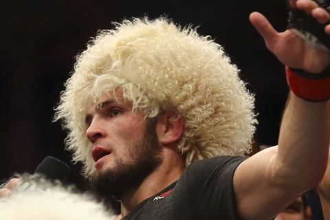 Russian UFC fighter Khabib Nurmagomedov, speaks after wining against UFC fighter Dustin Poirier, of Lafayette, La., during Lightweight title mixed martial arts bout at UFC 242, in Yas Mall in Abu Dhabi, United Arab Emirates, Saturday , Sept.7 2019. (AP Photo/ Mahmoud Khaled)