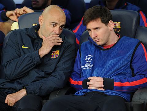 Barcelona's Argentinian forward Lionel Messi (R) sits on the bench during the UEFA Champions League semi-final second leg football match FC Barcelona vs FC Bayern Munich at the Camp Nou stadium in Barcelona on May 1, 2013.  AFP PHOTO / LLUIS GENE        (Photo credit should read LLUIS GENE/AFP/Getty Images)