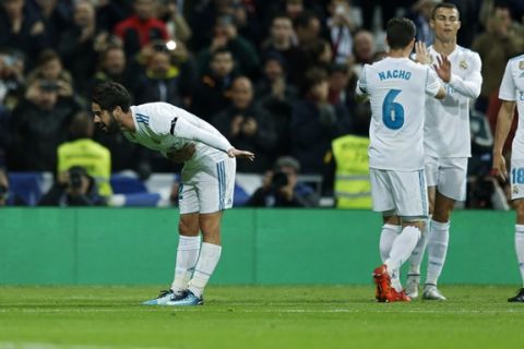 Real Madrid's Francisco Roman "Isco", left, gestures to supporters after scoring his side's third goal against Las Palmas during the Spanish La Liga soccer match between Real Madrid and Las Palmas at the Santiago Bernabeu stadium in Madrid, Sunday, Nov. 5, 2017. Isco scored once in Real Madrid's 3-0 victory. (AP Photo/Francisco Seco)