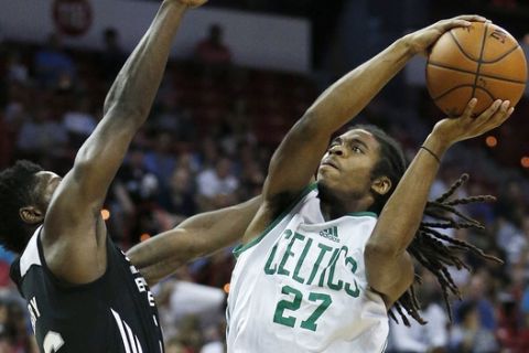 Boston Celtics Marcus Thornton goes up for a basket against San Antonio Spurs Will Cherry during the first half of an NBA summer league basketball game Saturday, July 18, 2015, in Las Vegas. (AP Photo/John Locher)