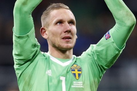 Sweden goalkeeper Robin Olsen celebrates at the end of the World Cup qualifying play-off second leg soccer match between Italy and Sweden, at the Milan San Siro stadium, Italy, Monday, Nov. 13, 2017. Four-time champion Italy has failed to qualify for World Cup; Sweden advances with 1-0 aggregate win in playoff. (AP Photo/Antonio Calanni)