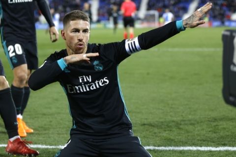 Real Madrid's Sergio Ramos celebrates after scoring his side's third goal during a Spanish La Liga soccer match between Real Madrid and Leganes at the Butarque stadium in Leganes, outside Madrid, Wednesday, Feb. 21, 2018. Real Madrid won 3-1.  (AP Photo/Francisco Seco)