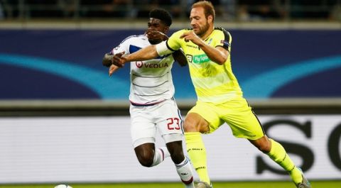 GENT, BELGIUM - SEPTEMBER 16:  Laurent Depoitre of Gent battles for the ball with Samuel Umtiti of Lyon during the UEFA Champions League Group H match between KAA Gent and Olympique Lyonnais held at Ghelamco Arena on September 16, 2015 in Gent, Belgium.  (Photo by Dean Mouhtaropoulos/Getty Images)