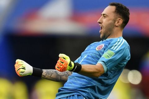Colombia goalkeeper David Ospina celebrates after teammate Yerry Mina scored the opening goal during the group H match between Senegal and Colombia, at the 2018 soccer World Cup in the Samara Arena in Samara, Russia, Thursday, June 28, 2018. (AP Photo/Martin Meissner)