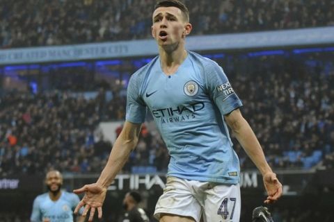 Manchester City's Phil Foden celebrates after scoring during the English FA Cup third round soccer match between Manchester City and Rotherham United at Etihad stadium in Manchester, England, Sunday, Jan. 6, 2019. (AP Photo/Rui Vieira)