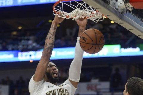 New Orleans Pelicans forward Anthony Davis (23) dunks the ball against Denver Nuggets during the second half of an NBA basketball game in New Orleans, Saturday, Nov. 17, 2018. The Pelicans won, 125-115. (AP Photo/Veronica Dominach)