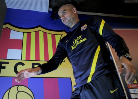 FC Barcelona's coach Pep Guardiola attends a press conference at the Camp nou stadium in Barcelona on January 24, 2012, on the eve of the Spanish Cup "El clasico" football match between Barcelona and Real Madrid.  AFP PHOTO / JOSEP LAGO (Photo credit should read JOSEP LAGO/AFP/Getty Images)