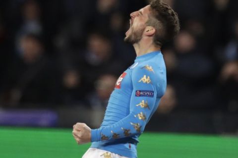 Napoli's Dries Mertens celebrates after scoring the opening goal during the Champions League round of 16, second leg, soccer match between Napoli and Real Madrid at the San Paolo stadium in Naples, Italy, Tuesday March 7, 2017. (AP Photo/Andrew Medichini)