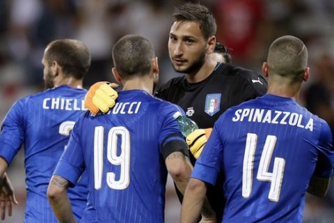 Italy goalkeeper Gianluigi Donnarumma celebrates with teammates his side's 3-0 win over Uruguay, at the end of a friendly soccer match at the Nice Allianz Riviera stadium, France, Wednesday, June 7, 2017. (AP Photo/Claude Paris)