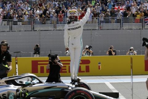 Mercedes driver Lewis Hamilton of Britain celebrates after he clocked the fastest time during the qualifying session at the Paul Ricard racetrack in Le Castellet, southern France, Saturday, June 22, 2019. The French Formula One Grand Prix will be held on Sunday. (AP Photo/Claude Paris)