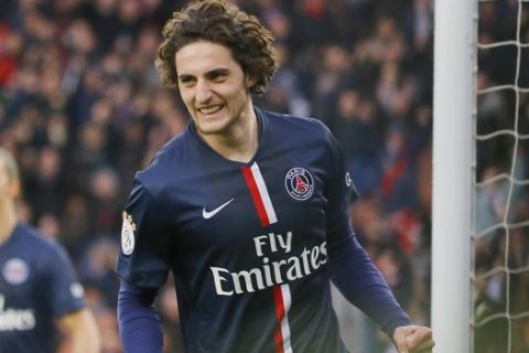PSG's Adrien Rabiot  reacts  after scoring against Toulouse FC during his French League one soccer match at the Parc des Princes stadium, in Paris, France, Saturday, Feb. 21, 2015. (AP Photo/Jacques Brinon)