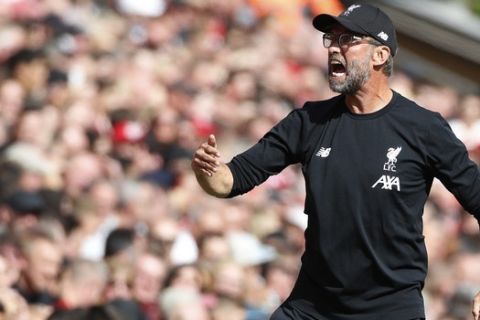 Liverpool's manager Jurgen Klopp shouts during the English Premier League soccer match between Liverpool and Newcastle at Anfield stadium in Liverpool, England, Saturday, Sept. 14, 2019. (AP Photo/Rui Vieira)