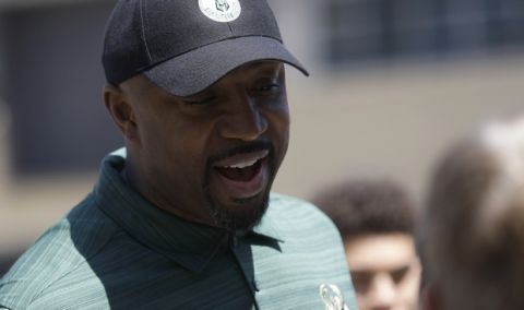 Former Milwaukee Bucks player Vin Baker talks to fans at a summer block party Saturday, June 6, 2015, in Milwaukee. (AP Photo/Aaron Gash) 