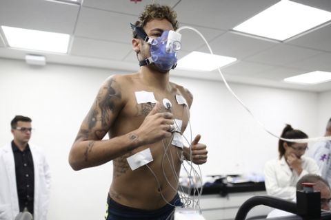 In this photo released by the Brazilian Football Confederation, CBF, Brazil's soccer player Neymar undergoes physical and medical exams at the Granja Comary training center, in Teresopolis, Brazil, Tuesday, May 22, 2018. Neymar will be expected to play about 45 minutes of the friendly against Croatia in Liverpool on June 3, the first of two for Brazil before the World Cup. (Lucas Figueiredo/CBF via AP)