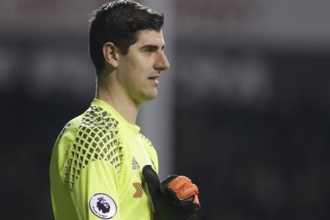 Chelsea goalkeeper Thibaut Courtois  pulls on his gloves during the English Premier League soccer match between Tottenham Hotspur and Chelsea at White Hart Lane stadium in London, Wednesday, Jan.  7,  2017. (AP Photo/Alastair Grant)