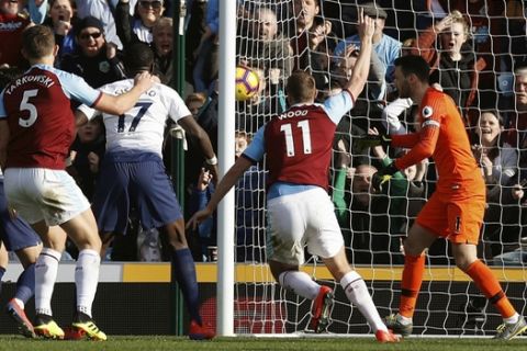 Burnley's Chris Wood scores his side's first goal of the game against Tottenham Hotspur during their English Premier League soccer match at Turf Moor in  Burnley, England, Saturday Feb. 23, 2019. (Martin Rickett/PA via AP)