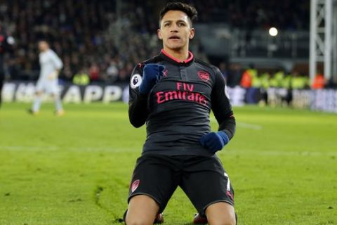 Arsenal's Alexis Sanchez celebrates after scoring his side's second goal of the game during their English Premier League soccer match between Crystal Palace and Arsenal at Selhurst Park stadium in London, Thursday, Dec. 28, 2017. (AP Photo/Alastair Grant)