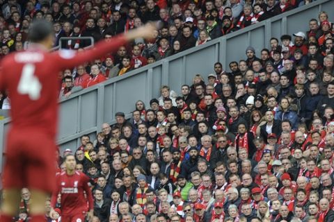 Liverpool's Virgil van Dijk gestures during the English Premier League soccer match between Liverpool and Tottenham Hotspur at Anfield stadium in Liverpool, England, Sunday, March 31, 2019. (AP Photo/Rui Vieira)
