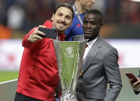 Manchester's injured player Zlatan Ibrahimovic takes a selfie after winning 2-0 during the soccer Europa League final between Ajax Amsterdam and Manchester United at the Friends Arena in Stockholm, Sweden, Wednesday, May 24, 2017. (AP Photo/Michael Sohn)