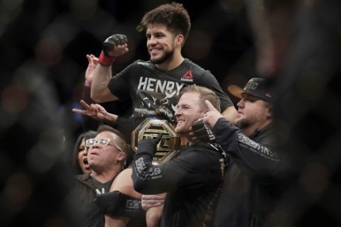 Henry Cejudo celebrates after a flyweight mixed martial arts championship bout against TJ Dillashaw at UFC Fight Night early Sunday, Jan. 20, 2019, in New York. Cejudo stopped Dillashaw in the first round. (AP Photo/Frank Franklin II)