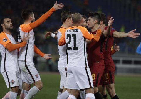 Roma and Shakhtar players face each others during a Champions League round of 16 second-leg soccer match between Roma and Shakhtar Donetsk, at the Rome Olympic stadium, Tuesday, March 13, 2018. (AP Photo/Gregorio Borgia)