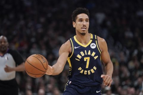 Indiana Pacers' Malcolm Brogdon dribbles during the second half of an NBA basketball game against the Milwaukee Bucks Wednesday, March 4, 2020, in Milwaukee. The Bucks won 119-100. (AP Photo/Morry Gash)