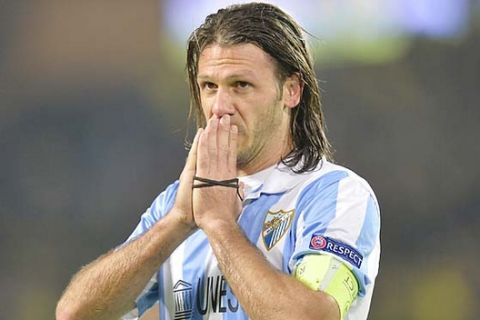 Malaga's Martin Demichelis from Argentina reacts at the end of the Champions League quarterfinal second leg soccer match between Borussia Dortmund and Malaga CF in Dortmund, Germany, Tuesday, April 9, 2013. (AP Photo/Martin Meissner)