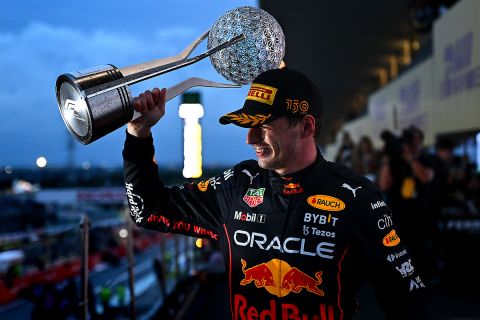 SUZUKA, JAPAN - OCTOBER 09: Race winner and 2022 F1 World Drivers Champion Max Verstappen of the Netherlands and Oracle Red Bull Racing celebrates on the podium during the F1 Grand Prix of Japan at Suzuka International Racing Course on October 09, 2022 in Suzuka, Japan. (Photo by Clive Mason/Getty Images)