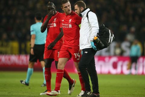 DORTMUND, GERMANY - APRIL 07:  An injured Jordan Henderson of Liverpool (14) speaks to medical staff during the UEFA Europa League quarter final first leg match between Borussia Dortmund and Liverpool at Signal Iduna Park on April 7, 2016 in Dortmund, Germany.  (Photo by Lars Baron/Bongarts/Getty Images)