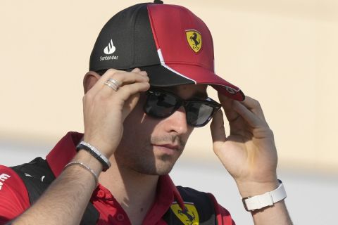 Ferrari driver Charles Leclerc of Monaco adjusts his sun glasses at the Bahrain International Circuit in Sakhir, Bahrain, Thursday, March 2, 2023. The Bahrain GP will be held on Sunday March 5, 2023.(AP Photo/Frank Augstein)