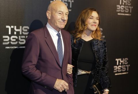 Actor Patrick Stewart and wife Sunny Ozell arrive to attend The Best FIFA 2017 Awards at the Palladium Theatre in London, Monday, Oct. 23, 2017. (AP Photo/Alastair Grant)