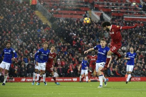 Liverpool's Mohamed Salah has a header on goal during their English Premier League soccer match against Everton at Anfield, Liverpool, England, Sunday, Dec. 10, 2017. (Peter Byrne/PA via AP)