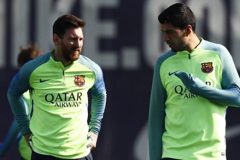 FC Barcelona's Lionel Messi, left, and Luis Suarez attend a training session at the Sports Center FC Barcelona Joan Gamper in Sant Joan Despi, Spain, Saturday, Feb. 18, 2017. FC Barcelona will play against Leganes in a Spanish La Liga on Sunday. (AP Photo/Manu Fernandez)