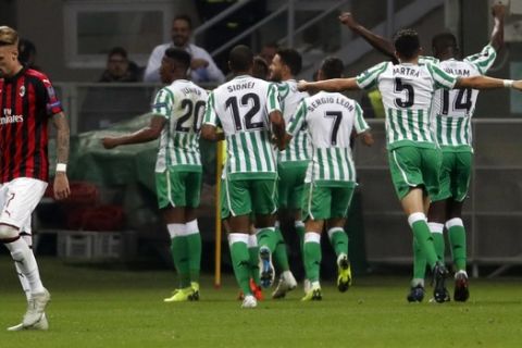 Betis players celebrate as Giovani Lo Celso scored his side's 2nd goal, during the Europa League, Group F soccer match between AC Milan and Betis, at the San Siro Stadium in Milan, Italy, Thursday, Oct. 25, 2018. (AP Photo/Antonio Calanni)