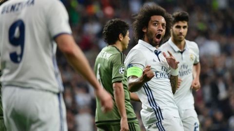 Real Madrid's Brazilian defender Marcelo celebrates after scoring during the UEFA Champions League football match Real Madrid CF vs Legia  Legia Warszawa at the Santiago Bernabeu stadium in Madrid on October 18, 2016. / AFP / PIERRE-PHILIPPE MARCOU        (Photo credit should read PIERRE-PHILIPPE MARCOU/AFP/Getty Images)