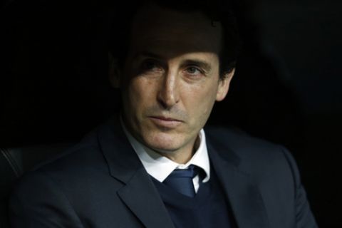 PSG head coach Unai Emery waits prior to a Champions League Round of 16 first leg soccer match between Real Madrid and Paris Saint Germain at the Santiago Bernabeu stadium in Madrid, Spain, Wednesday, Feb. 14, 2018. (AP Photo/Francisco Seco)