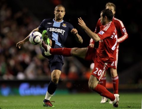 LIVERPOOL, ENGLAND - APRIL 19:   Manuel Da Costa of West Ham United is challenged by Javier Mascherano of Liverpool during the Barclays Premier League match between Liverpool and West ham United at Anfield on April 19, 2010 in Liverpool, England. (Photo by Alex Livesey/Getty Images)