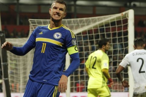 Bosnia's  Edin Dzeko reacts after he missed a the chance to score against Cyprus, during their World Cup Group  H  qualifying match at the Bilino Polje Stadium in Zenica on Monday, Oct. 10, 2016. (AP Photo/Amel Emric)