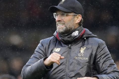 Liverpool's manager Juergen Klopp celebrates his side's 2-1 win at the end of the English Premier League soccer match between Fulham and Liverpool at Craven Cottage stadium in London, Sunday, March 17, 2019. (AP Photo/Kirsty Wigglesworth)