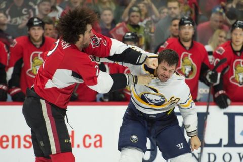 Dec 29, 2014; Ottawa, Ontario, CAN; Ottawa Senators defenseman Jared Cowen (2) fights with Buffalo Sabres right wing Patrick Kaleta (36) in the first period at the Canadian Tire Centre. Mandatory Credit: Marc DesRosiers-USA TODAY Sports