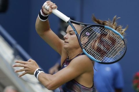 Maria Sakkari, of Greece, returns a shot from Venus Williams, of the United States, during the third round of the U.S. Open tennis tournament, Friday, Sept. 1, 2017, in New York. (AP Photo/Seth Wenig)