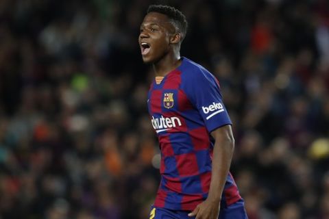 Barcelona's Ansu Fati celebrates after scoring his side's opening goal during a Spanish La Liga soccer match between Barcelona and Levante at the Camp Nou stadium in Barcelona, Spain, Sunday Feb. 2, 2020. (AP Photo/Joan Monfort)