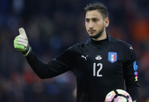 Italy's new goalkeeper Gianluigi Donnarumma shows thumb up during the international friendly soccer match between The Netherlands and Italy at the Amsterdam ArenA stadium, Netherlands, Tuesday, March 28, 2017. (AP Photo/Peter Dejong)
