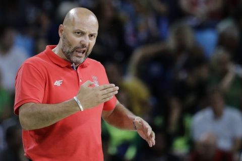 Serbia head coach Sasha Djordjevic directs his team during the men's gold medal basketball game against the United States at the 2016 Summer Olympics in Rio de Janeiro, Brazil, Sunday, Aug. 21, 2016. (AP Photo/Matt York)