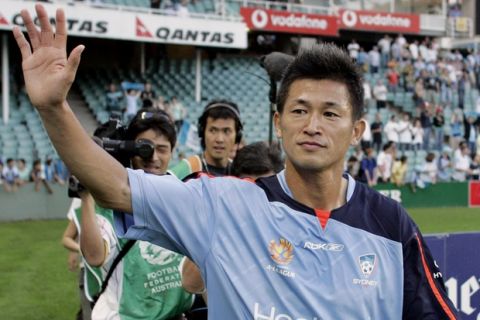 Japanese soccer star Kazuyoshi Miura waves to the crowd after his first game for Sydney FC in Sydney, Sunday, Nov. 13, 2005. Miura is Sydney Football Club's guest player and will play four matches in Australia's A-League competition before returning to Japan. (AP Photo/Mark Baker)