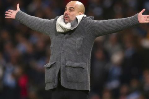 Manchester City coach Pep Guardiola reacts during the Champions League round of 16 second leg, soccer match between Manchester City and Schalke 04 at Etihad stadium in Manchester, England, Tuesday, March 12, 2019. (AP Photo/Dave Thompson)